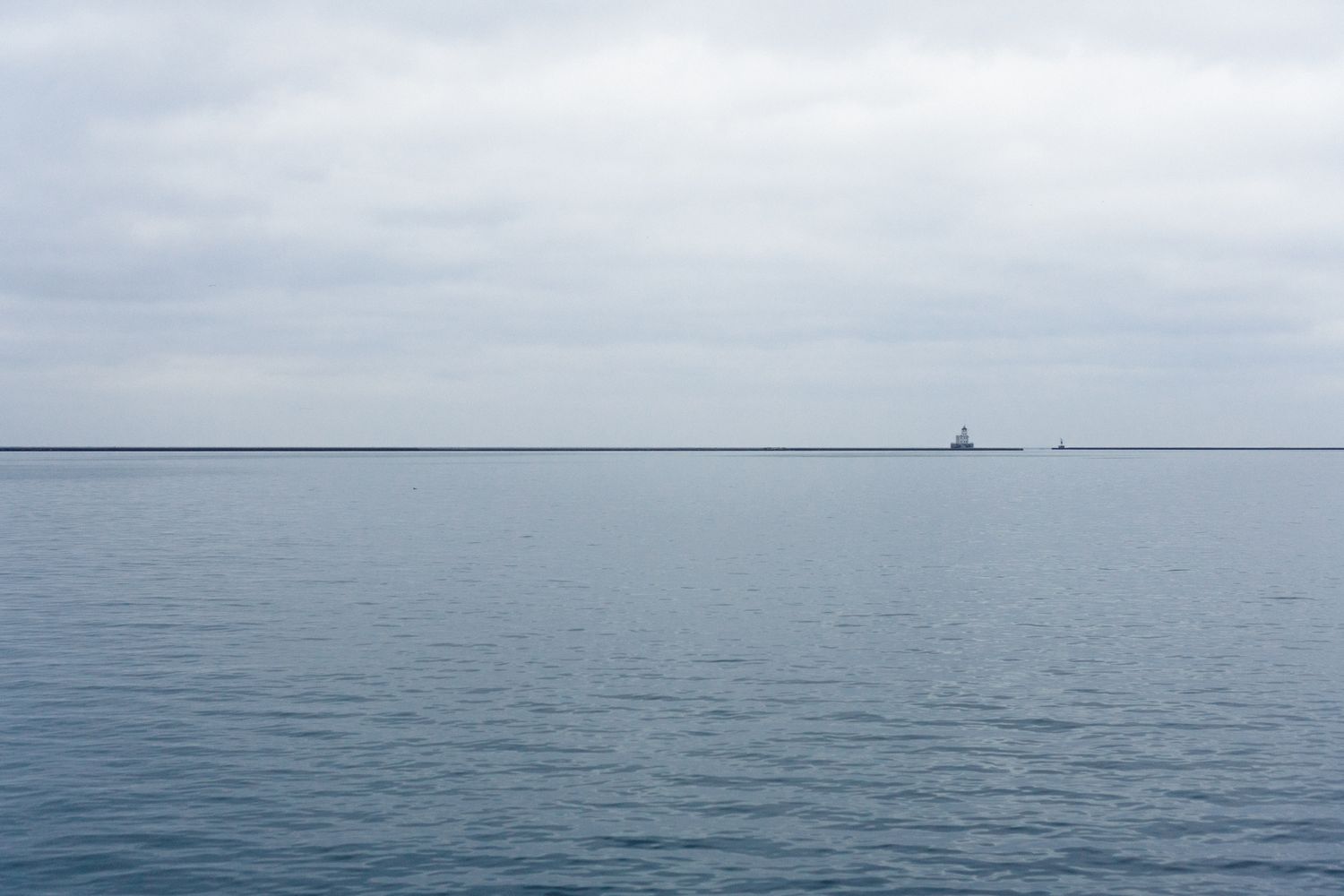 View across quiet and cloudy Lake Michigan