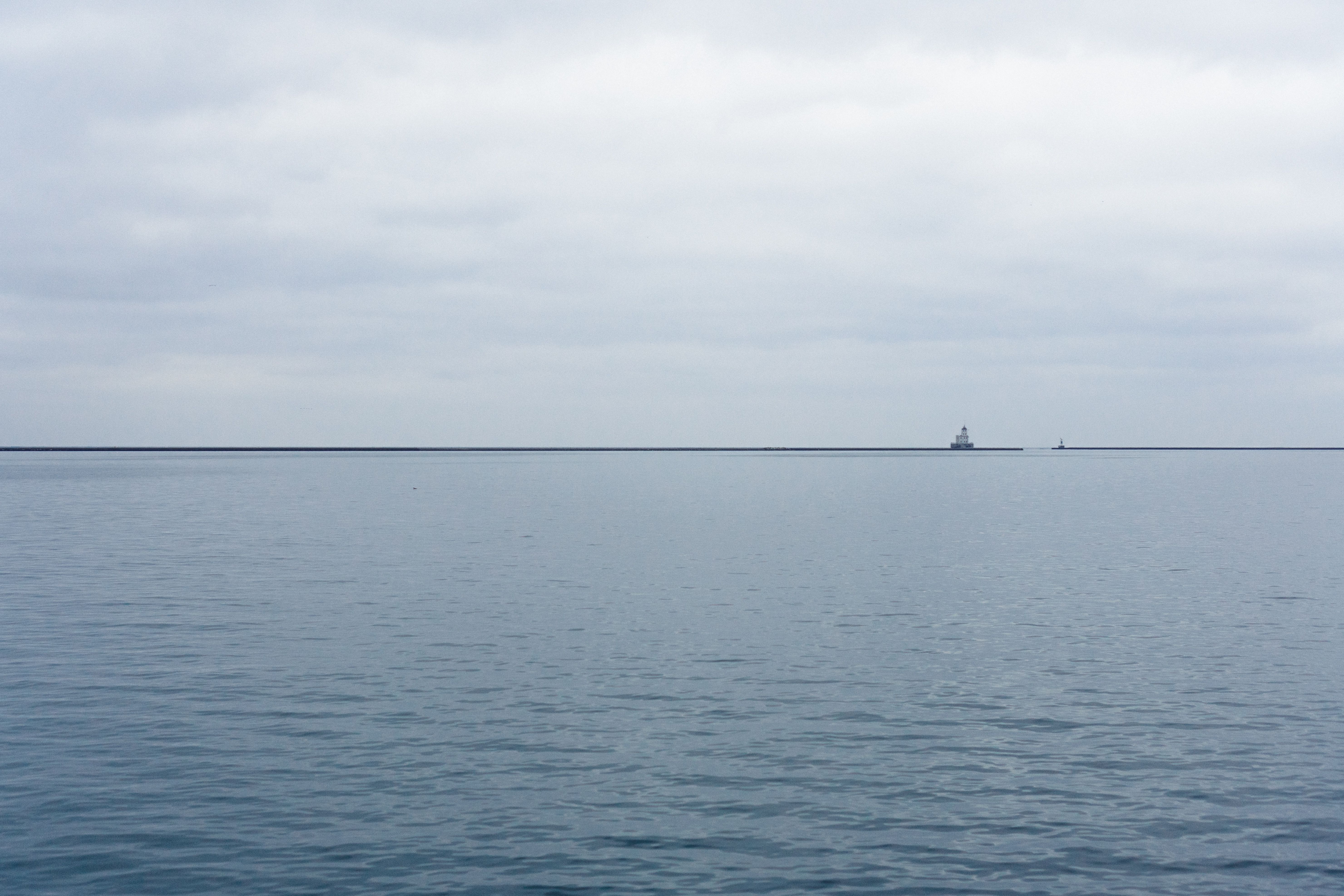 View across quiet and cloudy Lake Michigan